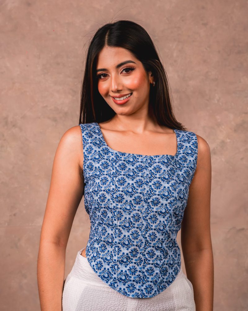 Portrait of a model in an indigo square-neck top
